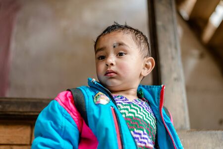 Kullu, Himachal Pradesh, India - April 01, 2019 : Portrait of Himalayan boy, Kid in himalayas in indiaのeditorial素材