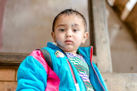 Kullu, Himachal Pradesh, India - April 01, 2019 : Portrait of Himalayan boy, Kid in himalayas in indiaのeditorial素材