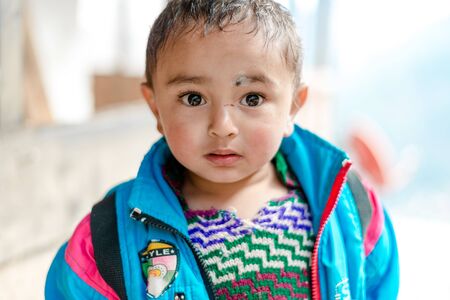 Kullu, Himachal Pradesh, India - April 01, 2019 : Portrait of Himalayan boy, Kid in himalayas in...