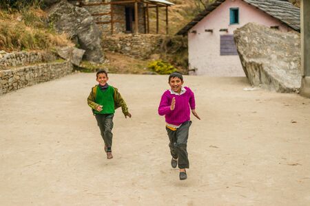 Kullu, Himachal Pradesh, India - February 04, 2019 : Photo of himalayan kid running in Himalayas -のeditorial素材