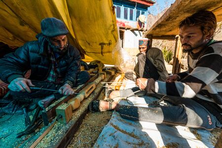 Kullu, Himachal Pradesh, India - December 03, 2018 : elderly carpenter builds a traditional design in himalayasのeditorial素材