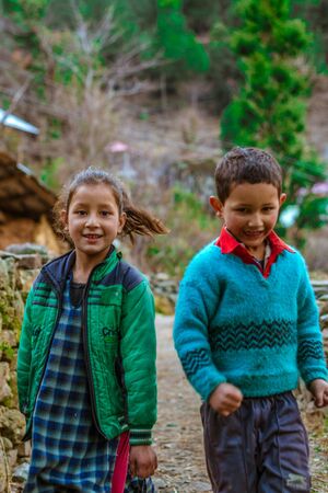 Kullu, Himachal Pradesh, India - February 04, 2019 : Photo of himalayan kid running in Himalayas -のeditorial素材