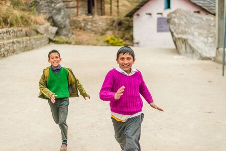 Kullu, Himachal Pradesh, India - February 04, 2019 : Photo of himalayan kid running in Himalayas -