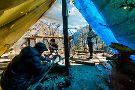 Kullu, Himachal Pradesh, India - December 03, 2018 : elderly carpenter builds a traditional design in himalayasのeditorial素材