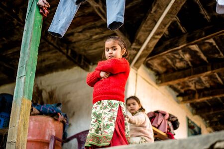 Kullu, Himachal Pradesh, India - December 21, 2018 : poor indian Twins girl child in mountainsのeditorial素材