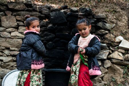 Kullu, Himachal Pradesh, India - December 21, 2018 : Photo of poor indian Twins girl child in mountainsのeditorial素材