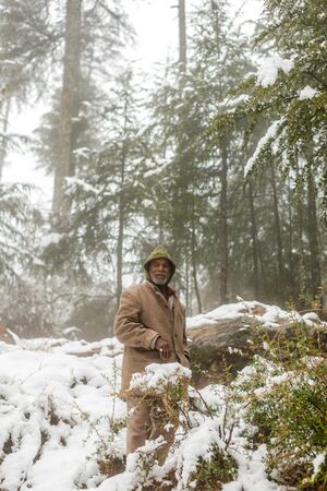 Kullu, Himachal Pradesh, India - January 22, 2019 : old man in snow - Tree in snow covered landscape in winter season in himalayas - Indiaのeditorial素材