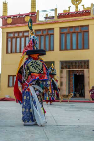 Spiti, Himachal Pradesh, India - March 24, 2019 : Tibetan buddhist lamas dressed in mystical mask dance Tsam mystery in time of festival in himalayasのeditorial素材