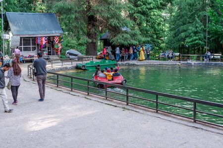 Manali, Himachal Pradesh, India - May 07, 2019 : Photo of Tourist enjoying boating in van vihar national park in himalayasのeditorial素材