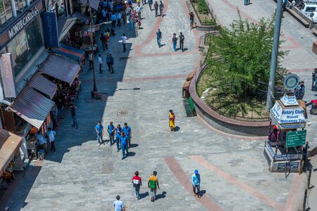 Kullu, Himachal Pradesh, India - May 29, 2019 : People roaming on the mall road in himalayas -