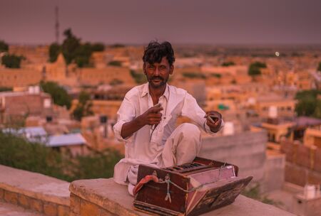 Jaisalmer, Rajasthan, India - July 29, 2019 : Indian musicians in traditional dress playing musical instruments -のeditorial素材