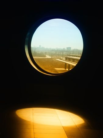 dark window and view on railway station, blue sky and sun            の写真素材
