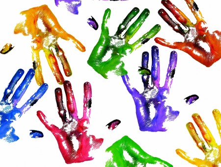 Photo of multi-colored handprints on white backgroundの写真素材