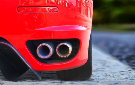 Photo of red car on highwayの写真素材