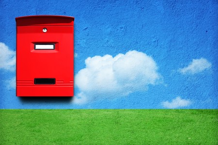 red mail box on the wall with landscapeの写真素材