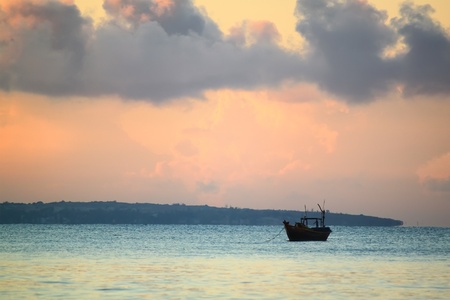 sunrise on sea with fishing boat, Vietnam