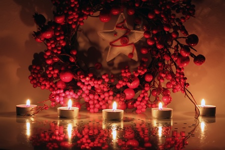 Photo of christmas garland and candlesの写真素材