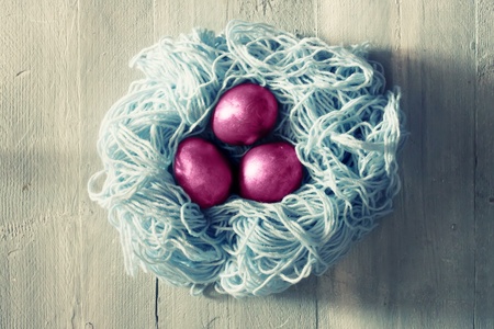 Cute retro photo with pink easter eggsの写真素材