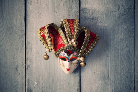 Photo of carnival mask on wooden backgroundの写真素材
