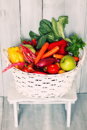 white basket with vegetablesの写真素材
