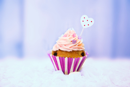 Photo of cute cupcake on wooden backgroundの写真素材
