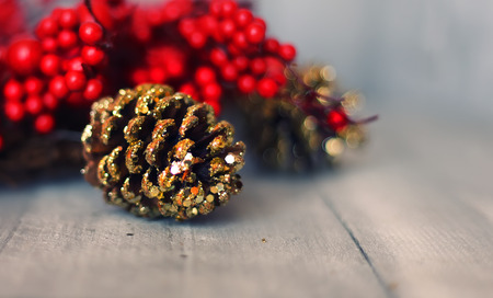 Photo of xmas decoration - golden pine coneの写真素材