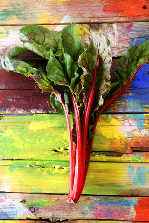 Photo beet leaves, mangold, on wooden backgroundの写真素材