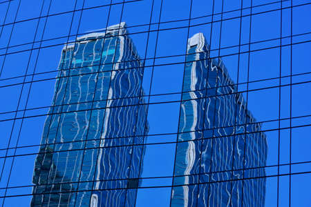 Blue glass curtain wall and a building projection
