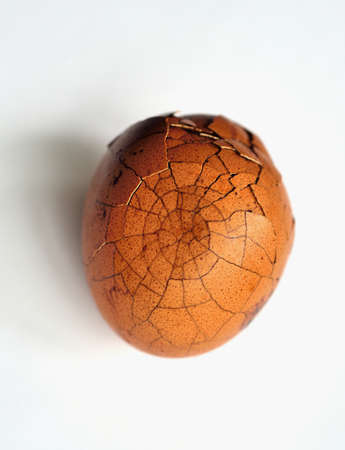 Closeup on cracked herbal eggの写真素材