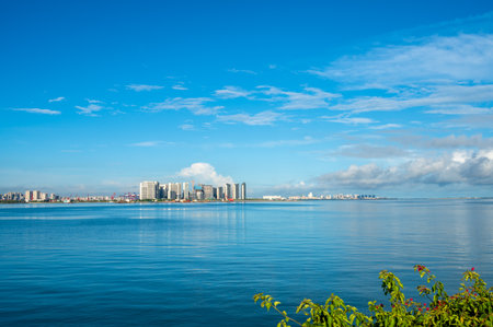 Seascape with buildings and blue sky at Pattaya city, Thailandの写真素材