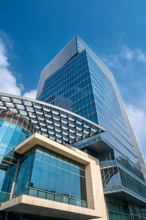 Modern office building with blue sky and white clouds, Moscow, Russia
