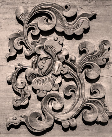 Wooden carving in the form of a flower on the wall.の写真素材