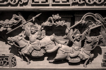 Woodcarving on the wall in a Chinese temple, closeup of photoのeditorial素材