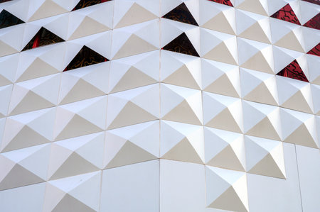 Detail of the facade of a modern building made of geometric shapes