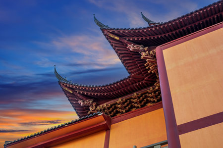 Chinese temple roof at sunset in Beijing, China. Chinese architecture.