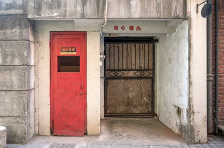 Old red door in a street in Shanghai, China. Shanghai is the capital and largest city of China.の写真素材