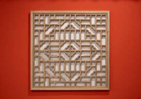 Wooden window on a red wall. Decorated with decorative elements.の写真素材