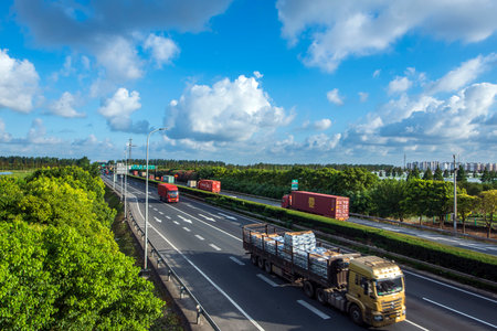 Truck on the road with cars and cargo containers on the sidesのeditorial素材