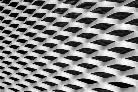 Black and white perforated metal background. 3d render illustrationの写真素材