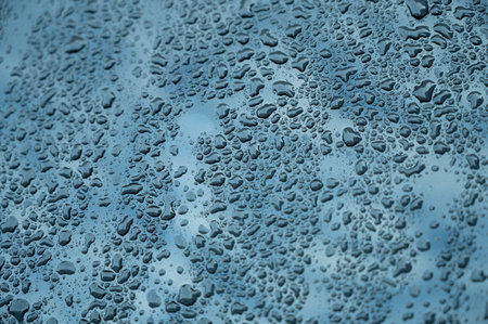 Water drops on the car window, close up. Abstract background.の写真素材
