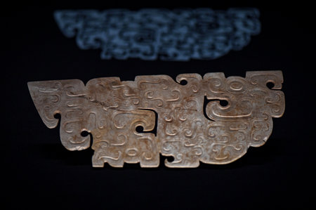 Close up view of old metal alphabet letters on a black background.