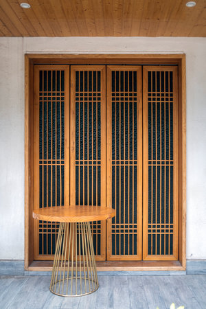 Wooden door and chair in the old building,Thailand.の写真素材