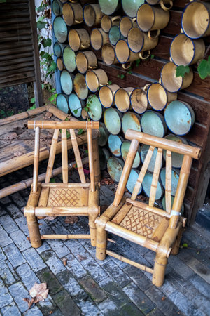 Wooden chairs in a wooden terrace in a summer garden.の写真素材