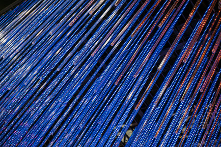 Blue and white christmas lights on a dark background. Christmas background.の写真素材