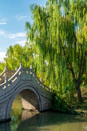 Stone bridge over the river in a park, closeup of photoの写真素材