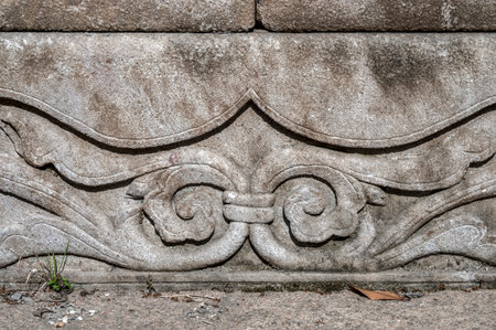 Stone carving on the wall of a temple in Bali, Indonesia