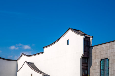 Architectural detail of a modern building with blue sky in the background