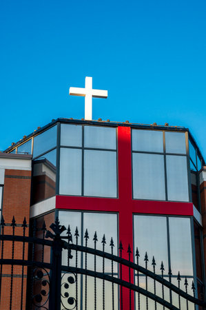 Cross on the facade of a church against the blue sky. Religionの写真素材