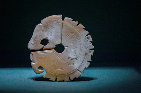 Ancient Chinese artifact in the dark, closeup of photo