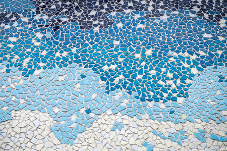 Colorful ceramic mosaic on the wall of the house. Abstract background